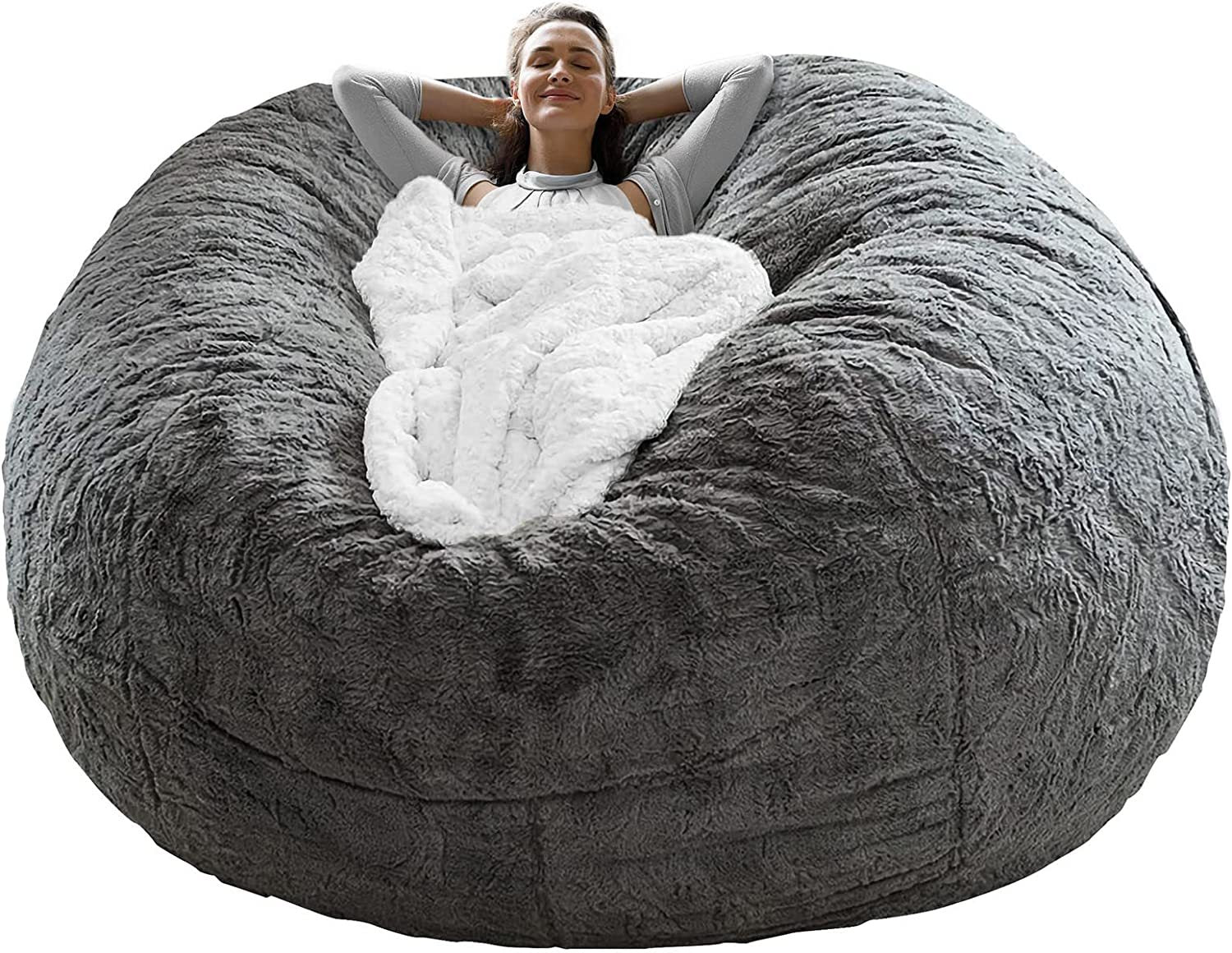 Shopi Vella fluffy velvet sofa bed cover in gray with soft white interior and a person relaxing
