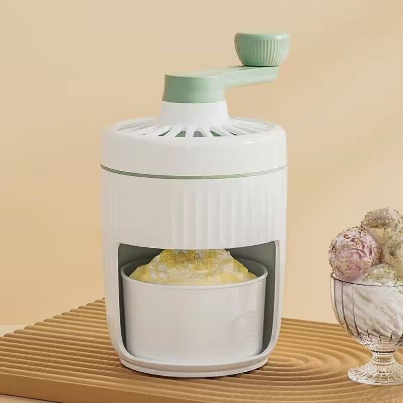 Shopi Vella manual ice shaving machine for home in white and green with bowl of shaved ice