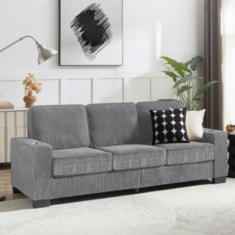 Modern gray fabric sofa with decorative pillows in a bright room showcasing modern living room furniture
