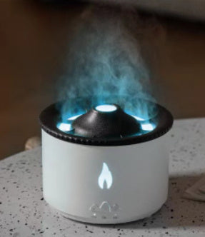 Shopi Vella color changing humidifier with night light emitting mist on a speckled countertop