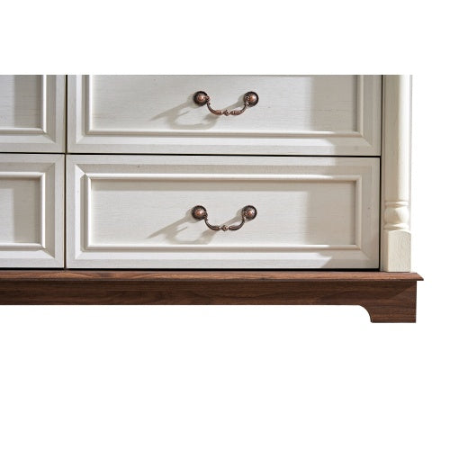 Close up of white 10 drawer dresser for bedroom with antique brass handles and wooden base by Shopi Vella