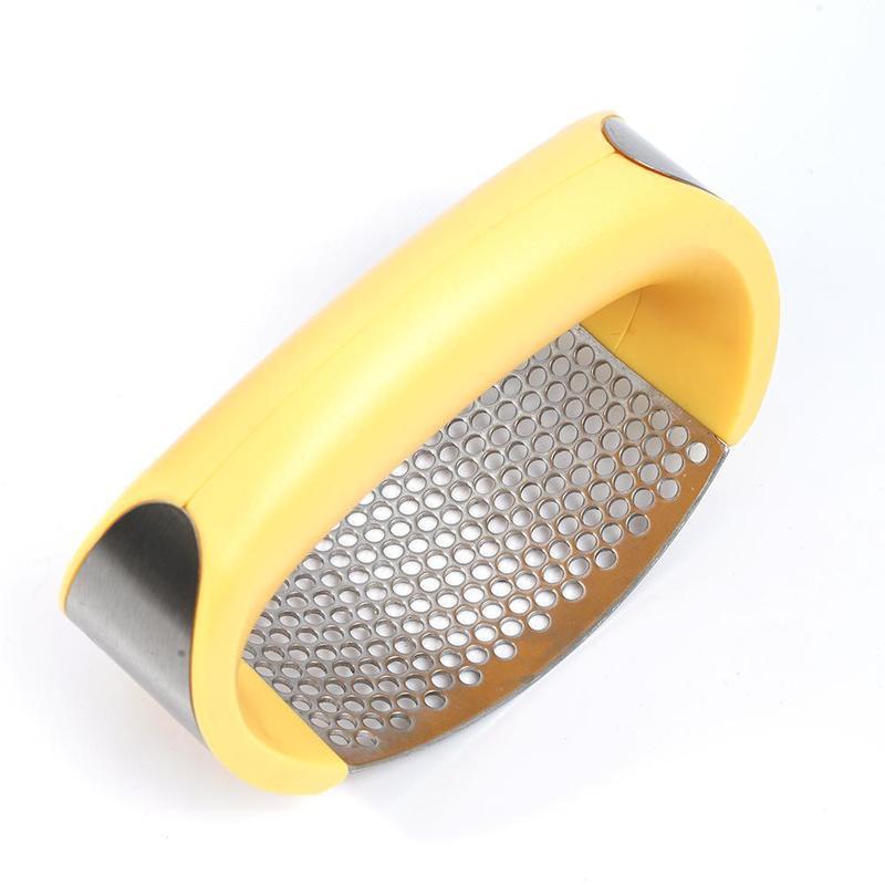 Shopi Vella stainless steel garlic press with yellow ergonomic handle for easy garlic crushing
