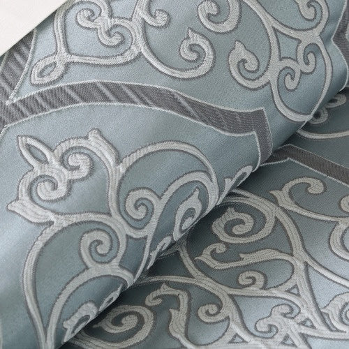Close-up of intricate embroidery on the 12 piece blue comforter set cal king from Shopi Vella