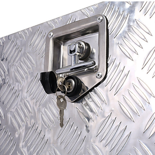 Close-up of lock and keys on 24 inch aluminum truck tool box by Shopi Vella with textured surface