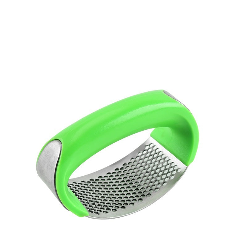 Shopi Vella stainless steel garlic press with ergonomic green handle for easy garlic crushing