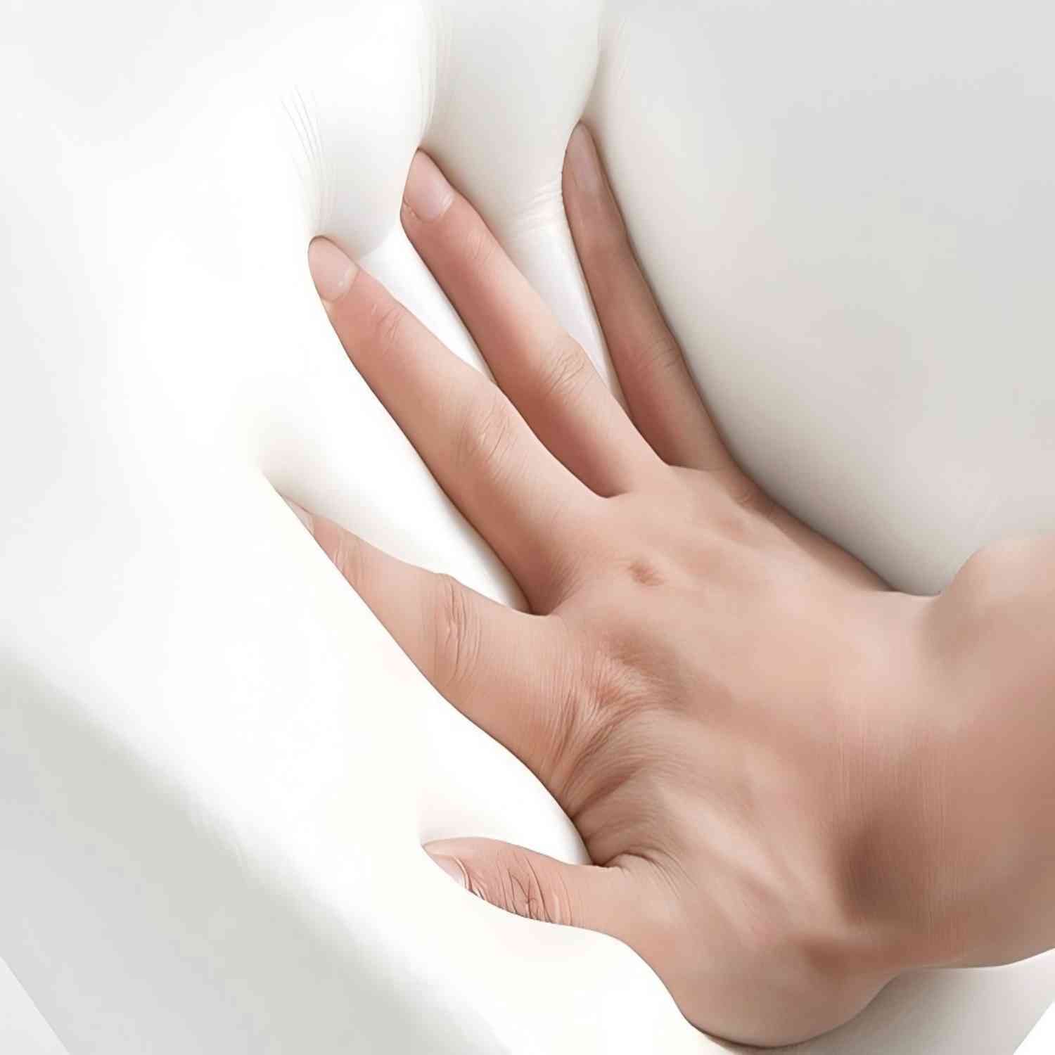 Hand pressing into soft white 3-inch memory foam mattress topper showcasing its contouring comfort