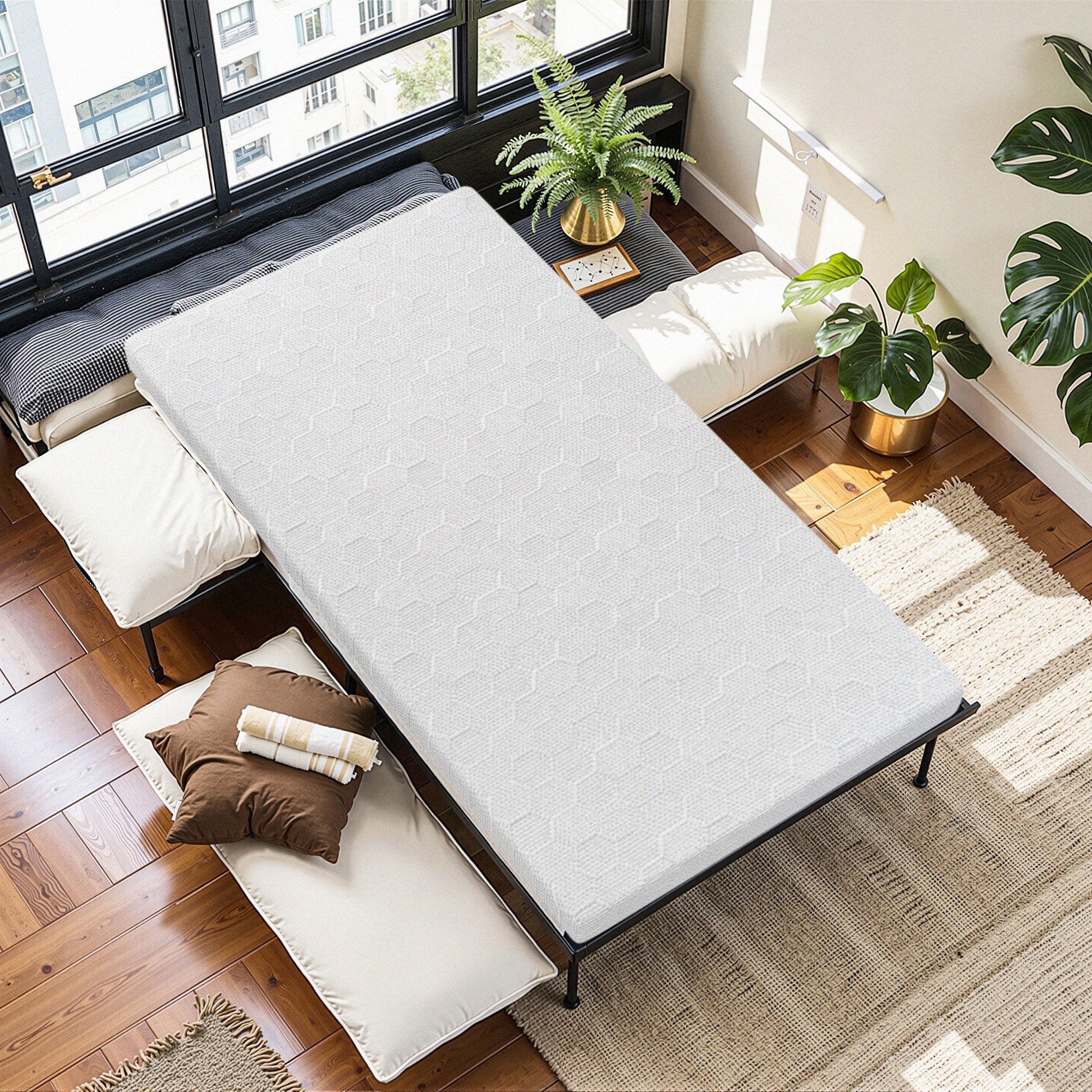 Shopi Vella 3-inch memory foam mattress topper on bed in bright modern room with plants and pillows