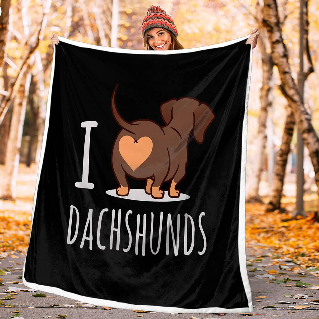 Shopi Vella black 3D printed dog blanket with I love dachshunds design held outdoors