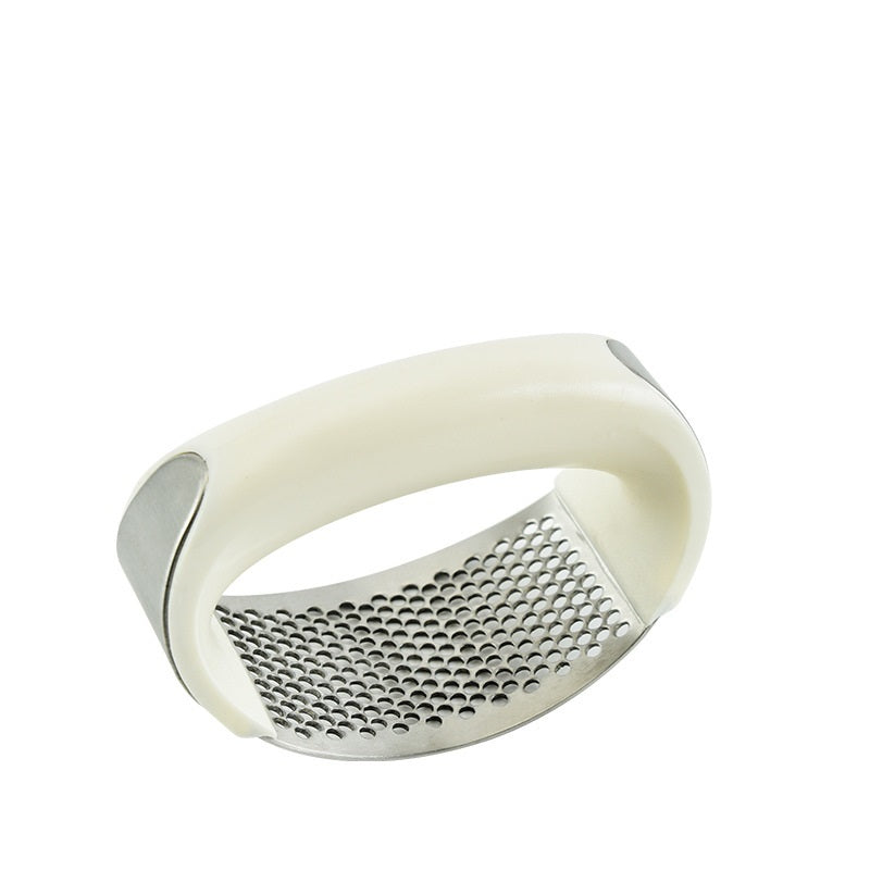 Shopi Vella stainless steel garlic press with ergonomic white handle for easy kitchen storage