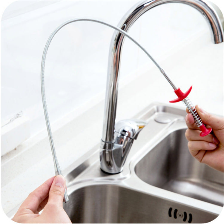 60cm hair cleaner for kitchen sink held by hands near stainless steel sink and faucet