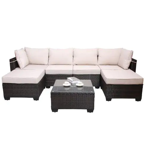 7 piece outdoor patio furniture set with dark wicker frame and beige cushions including sectional sofa and coffee table