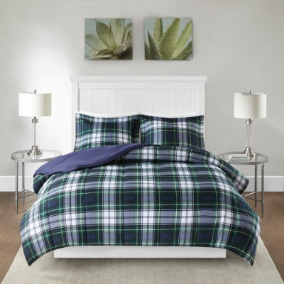 Shopi Vella Scotchgard comforter set in blue green plaid pattern on white bed with matching pillow shams