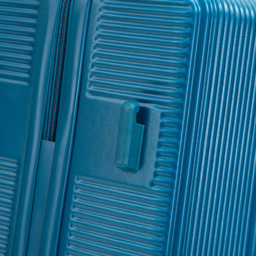 Close-up of blue ABS spinner wheel luggage set with textured hard shell and side handle