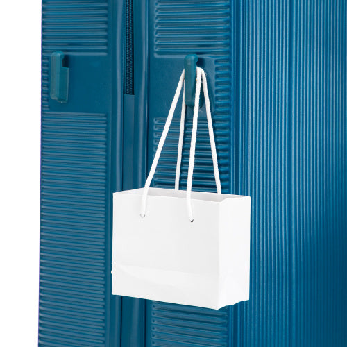 Blue ABS spinner wheel luggage set with white shopping bag hanging on handle