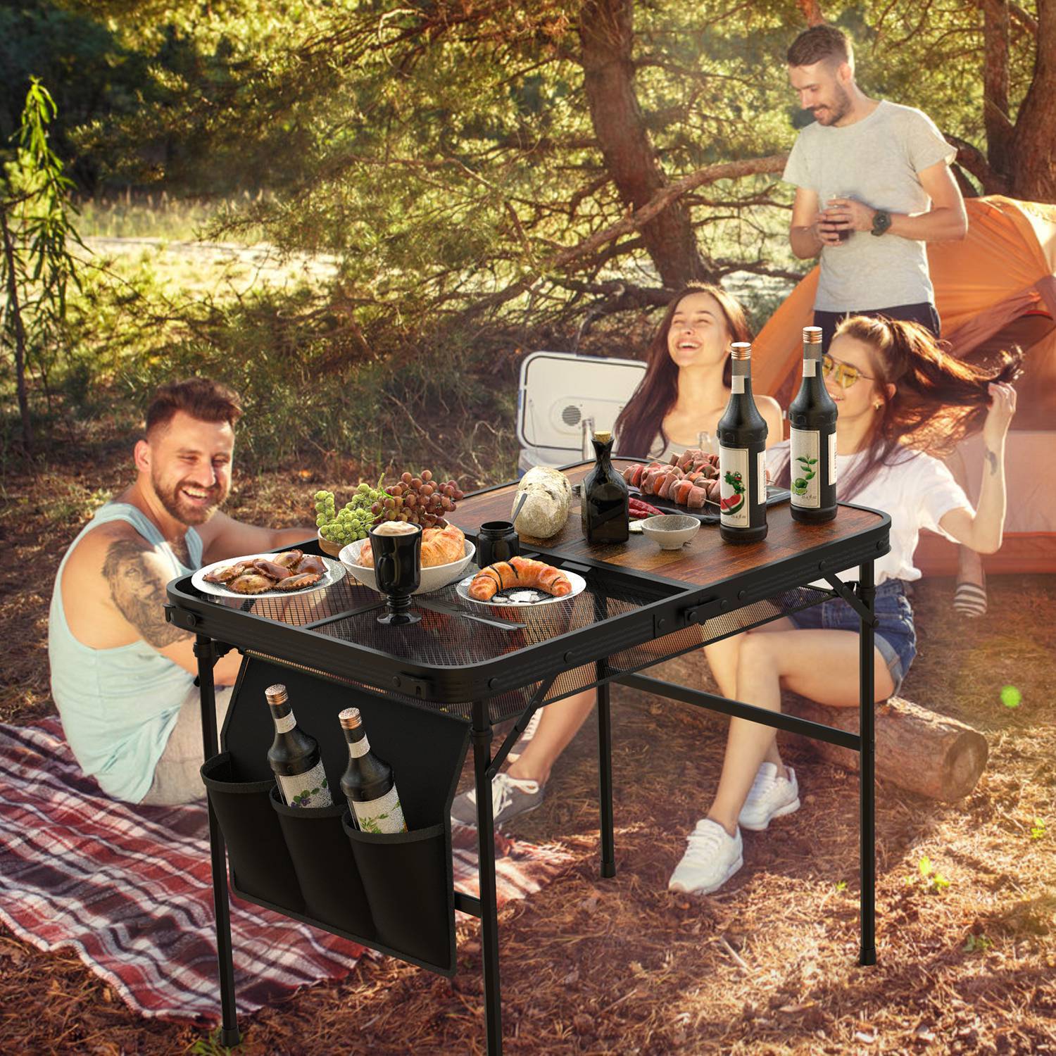 Adjustable height picnic grill table by Shopi Vella with food and drinks outdoors at a camping picnic