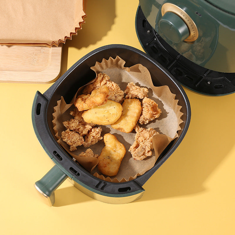 Shopi Vella air fryer disposable paper liners inside air fryer with fried chicken and nuggets