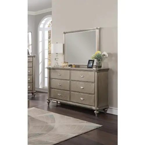 Antique champagne finish bedroom furniture dresser with six drawers and a large matching mirror
