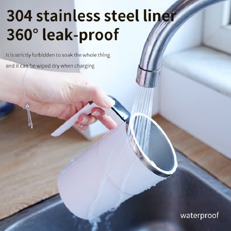 Shopi Vella automatic coffee stirring cup with 304 stainless steel liner being rinsed under faucet