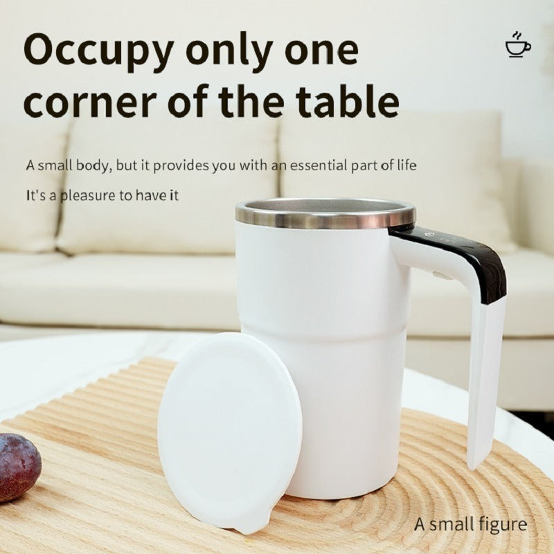 Shopi Vella white automatic coffee stirring cup with black handle and lid on wooden table