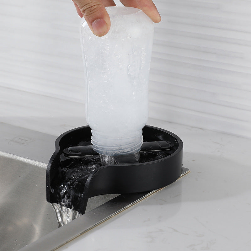 Shopi Vella automatic cup washer for sink cleaning a frosted plastic cup in black device