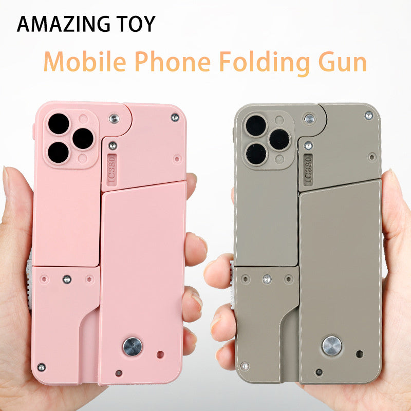 Shopi Vella mobile phone folding gun in pink and gray designed as an automatic shell throwing toy pistol