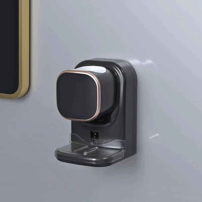 Black wall-mounted automatic toothpaste dispenser with sleek design and soap tray