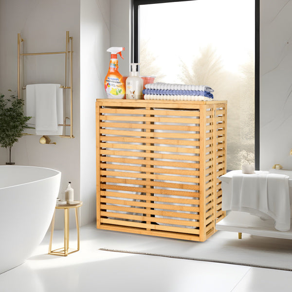 Shopi Vella bamboo laundry basket with lid in modern bathroom holding towels and cleaning supplies