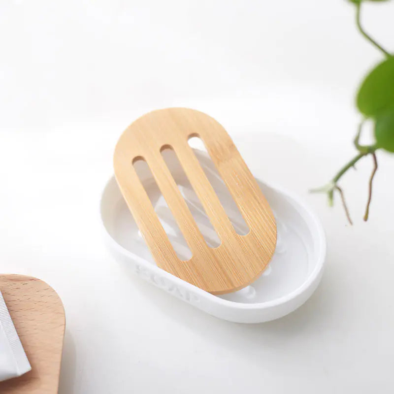 Minimalist bamboo toothbrush holder set with white base and slotted bamboo top for bathroom organization