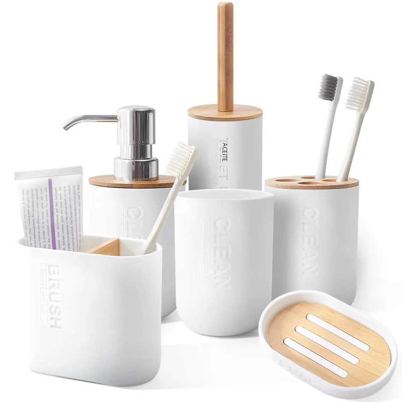 White and bamboo bathroom accessories including soap dispenser and bamboo toothbrush holder set