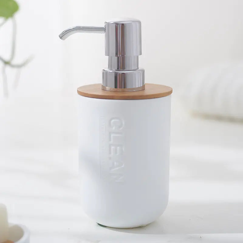 White soap dispenser with metal pump and bamboo lid from bamboo toothbrush holder set