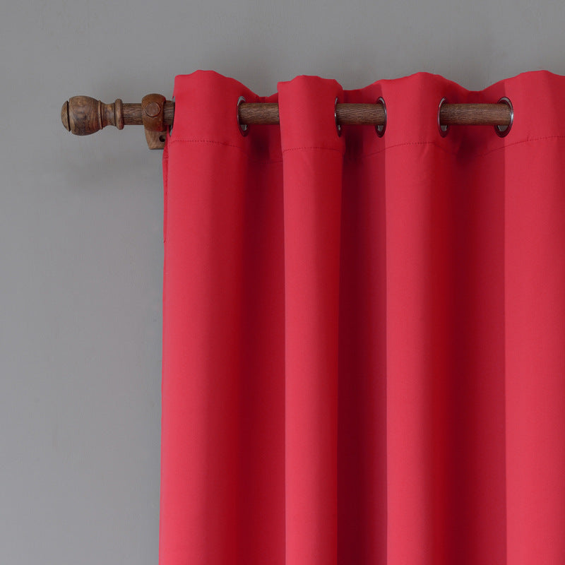 Shopi Vella red bedroom blackout curtain hanging on wooden rod with metal grommets