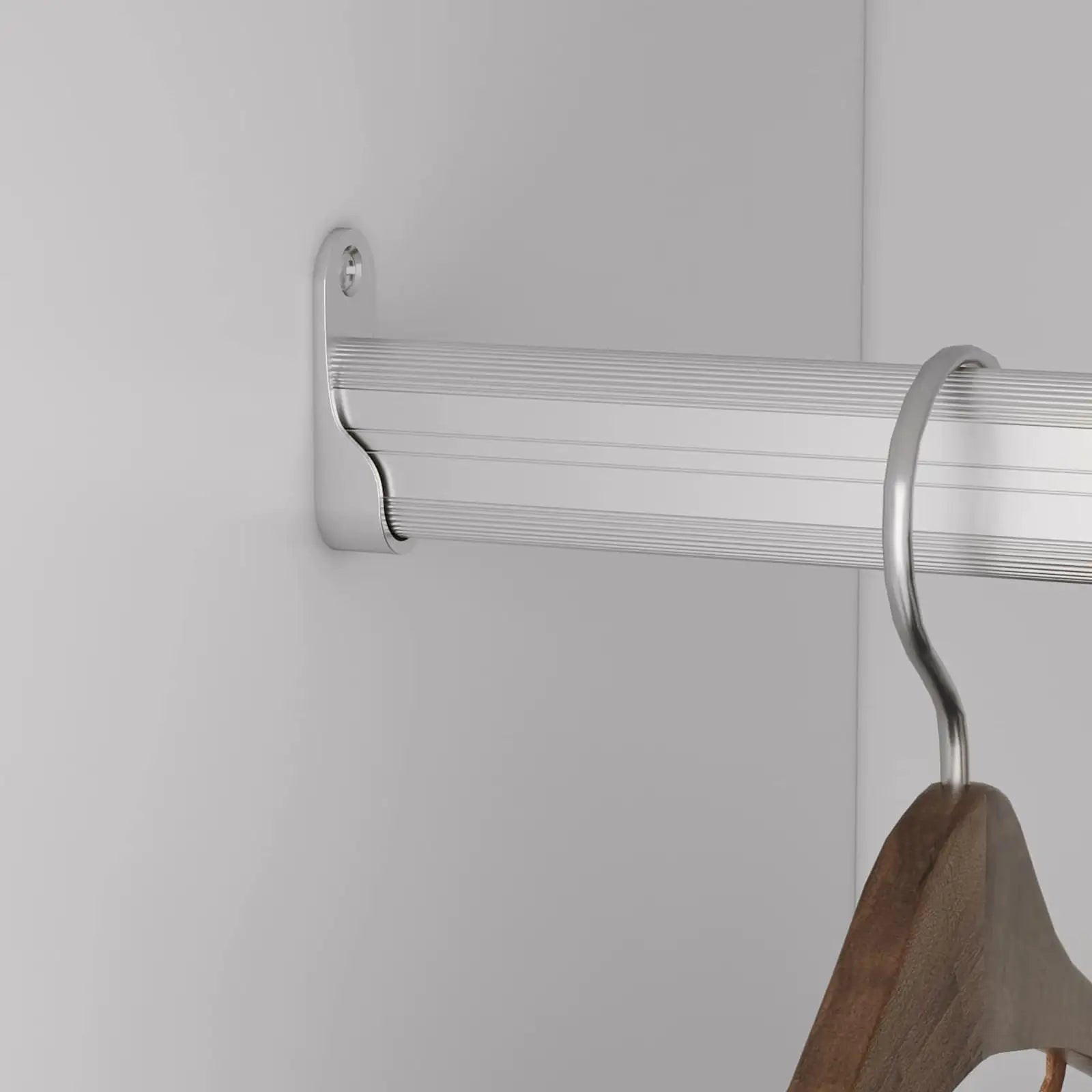 Close-up of bedroom closet rack and shelving aluminum rod with a wooden hanger in a white closet