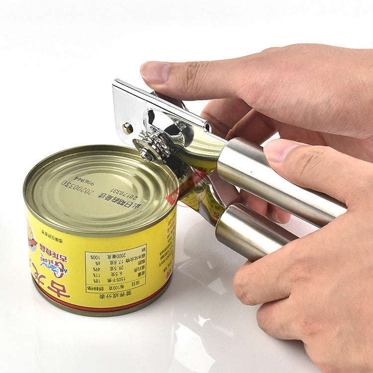 Shopi Vella stainless steel can opener being used to open a yellow can best can opener for kitchen storage
