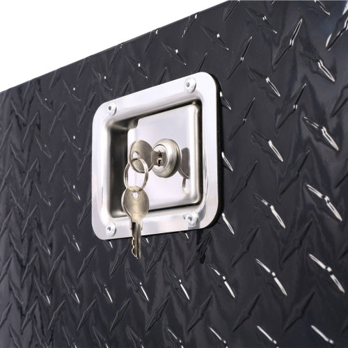Close-up of lock and keys on black diamond plate 29 inch truck bed tool box by Shopi Vella