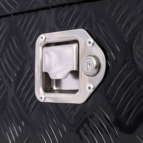 Close-up of lock and latch on 30 inch aluminum truck tool box with black diamond plate texture