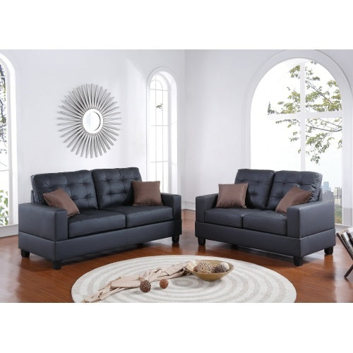Shopi Vella black faux leather sofa set with tufted cushions and brown accent pillows in modern living room