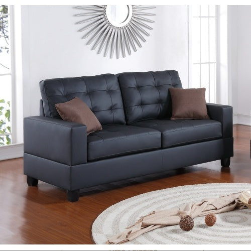 Shopi Vella black faux leather sofa set with tufted back cushions and brown accent pillows in modern living room