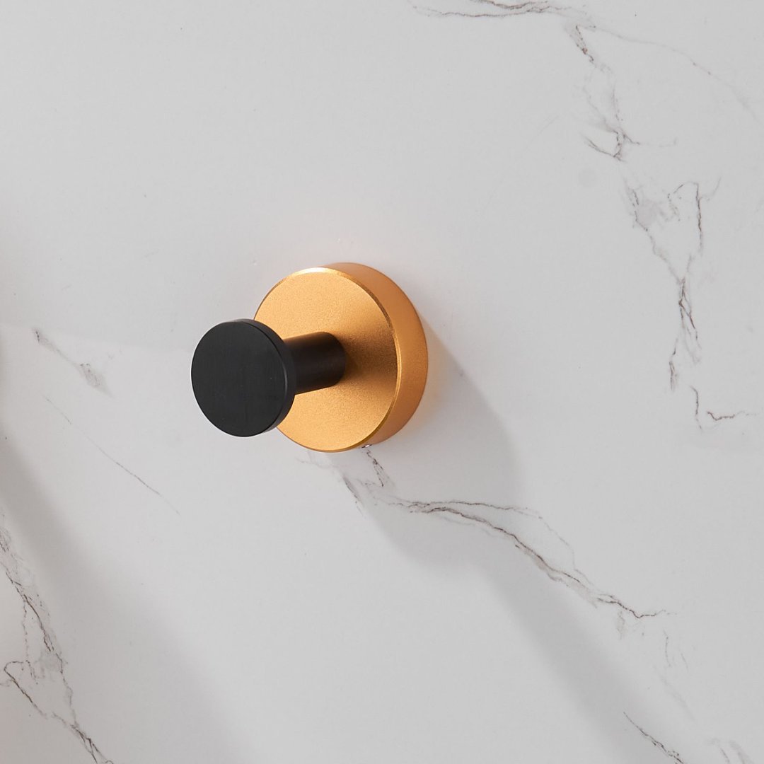 Shopi Vella black gold wall hooks set mounted on white marble bathroom wall for stylish storage