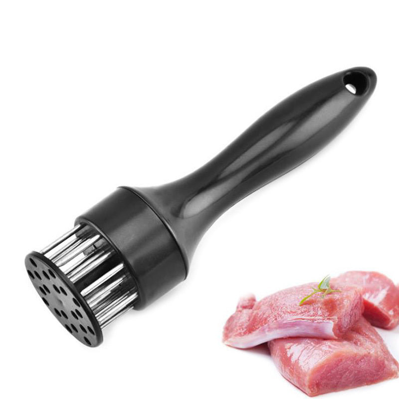 Shopi Vella stainless steel meat tenderizer with black handle next to raw meat slices