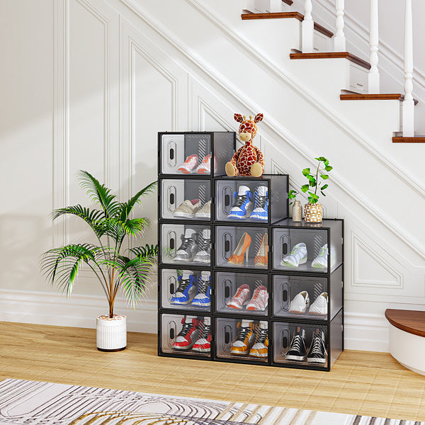Shopi Vella black plastic shoe box set stacked under staircase with various sneakers and decorative items