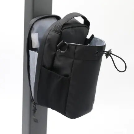 Shopi Vella portable magnetic water bottle pouch attached to a vertical surface in black color