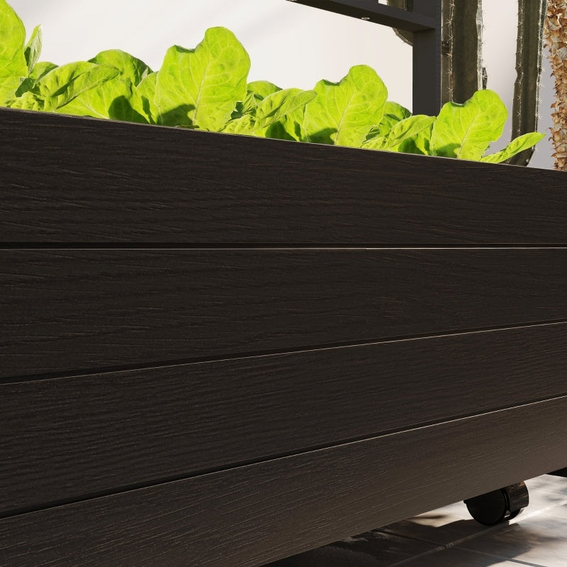 Shopi Vella black raised garden bed with trellis featuring fresh green leafy plants