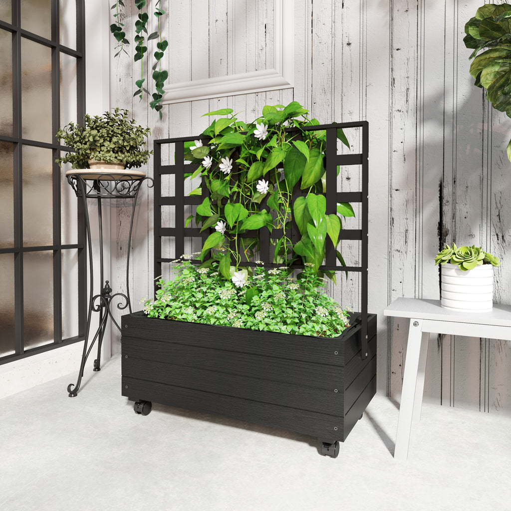 Shopi Vella black raised garden bed with trellis filled with green plants in a bright indoor space