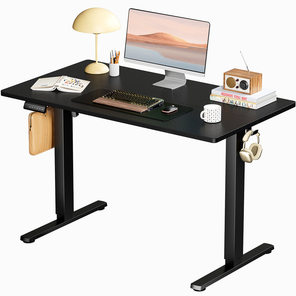 Shopi Vella black standing desk for home office with computer, lamp, headphones, and storage accessories