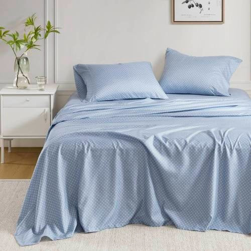 Blue floral comforter set queen on bed with matching pillowcases in a modern bedroom