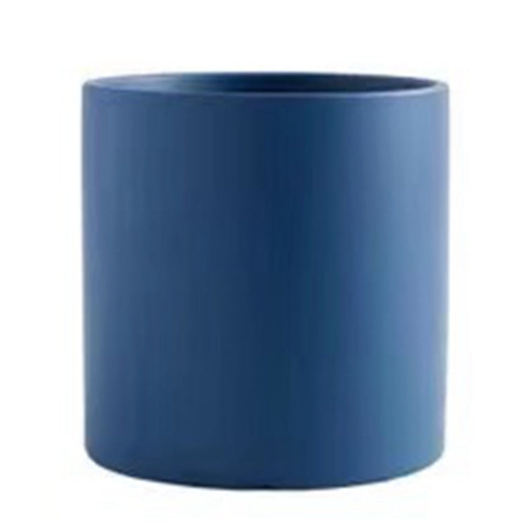 Blue industrial style planter pot for home storage by Shopi Vella with a modern cylindrical design