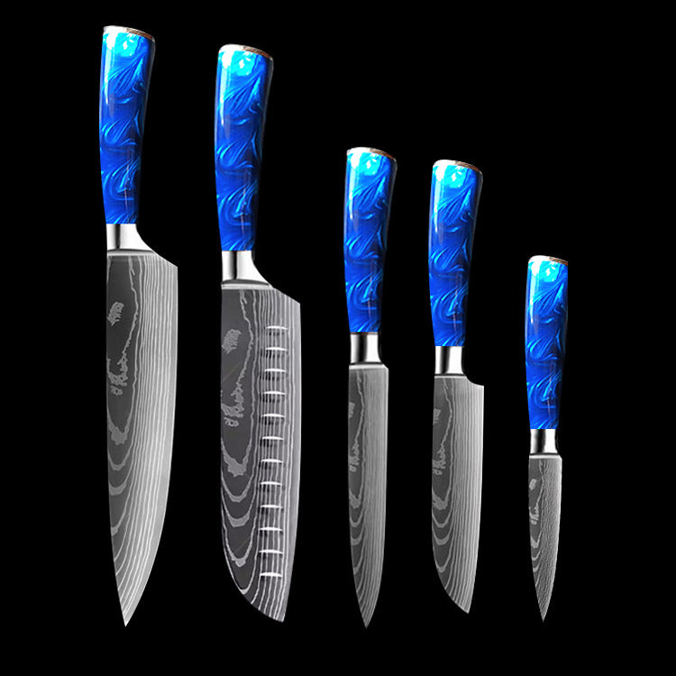 Set of kitchen knives with blue resin handle chef knife and patterned blades on black background