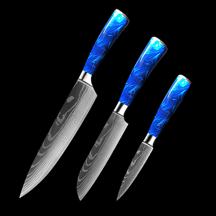Set of three kitchen knives with blue resin handle chef knife and patterned steel blades