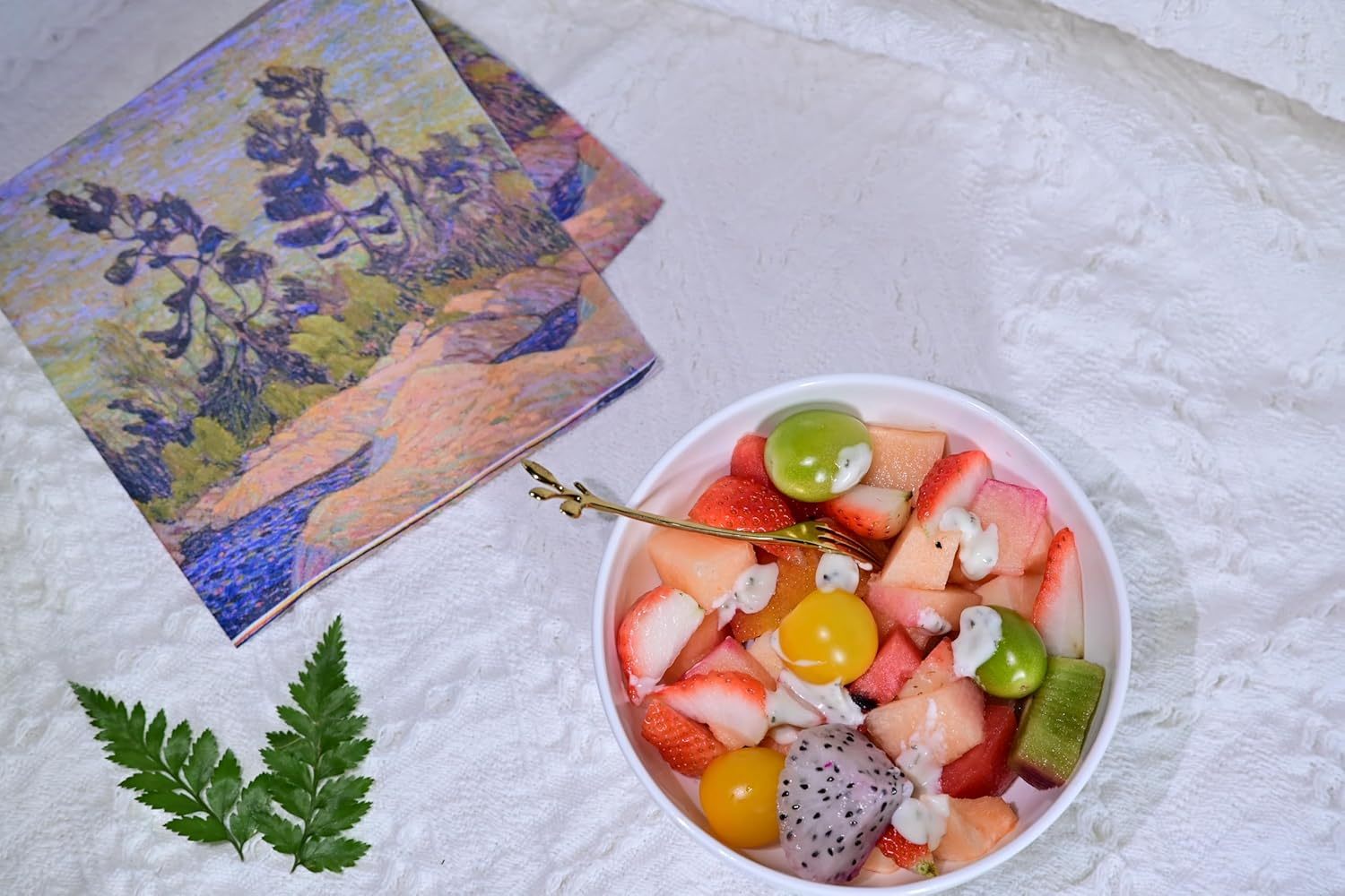 Shopi Vella bone china dinnerware set bowl filled with fresh mixed fruit on white textured surface