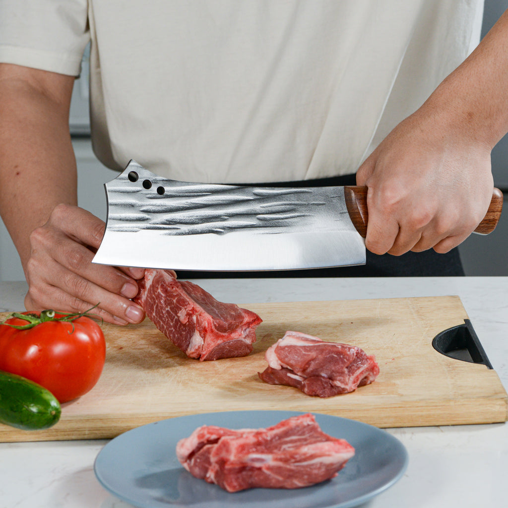Shopi Vella bone chopper knife for meat cutting raw meat on wooden cutting board with vegetables